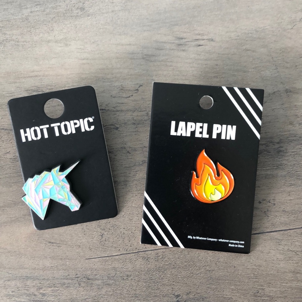 Two enamel pins
